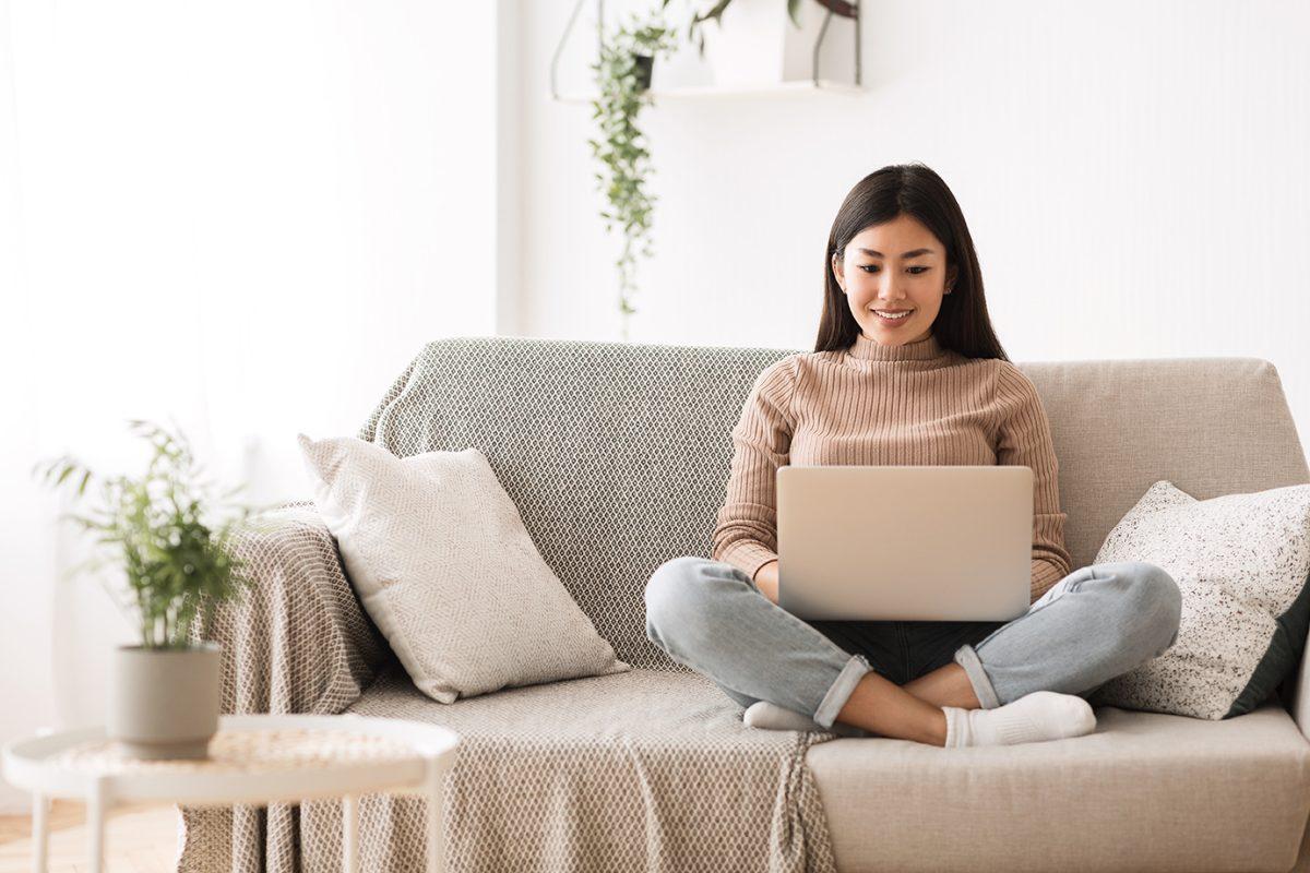 Recruitment Concept. Girl Browsing Work Opportunities Online, Using Job Search App or Website on Laptop, Copy Space