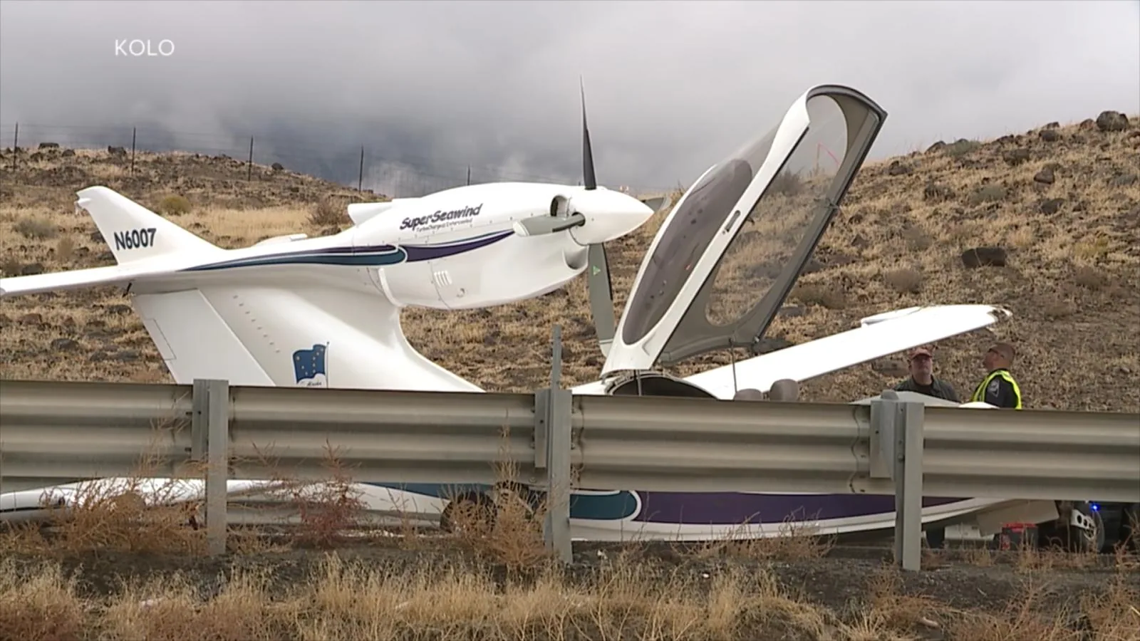 A small plane sits on Interstate 80 after an emergency crash landing outside Reno, Nevada