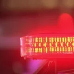 Emergency crews investigate a fatal crash scene on a highway in Iowa County, Wisconsin