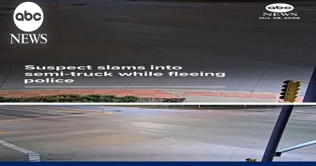 Traffic camera image of a car hitting a FedEx semi-truck at an Iowa intersection