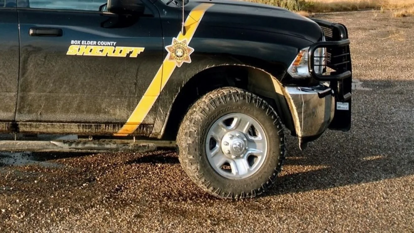 Police investigate a crash near the mouth of Ogden Canyon with vehicles at the roadside