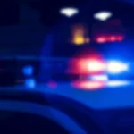 A sheriff's cruiser after a fatal crash investigation at a rural West Virginia intersection