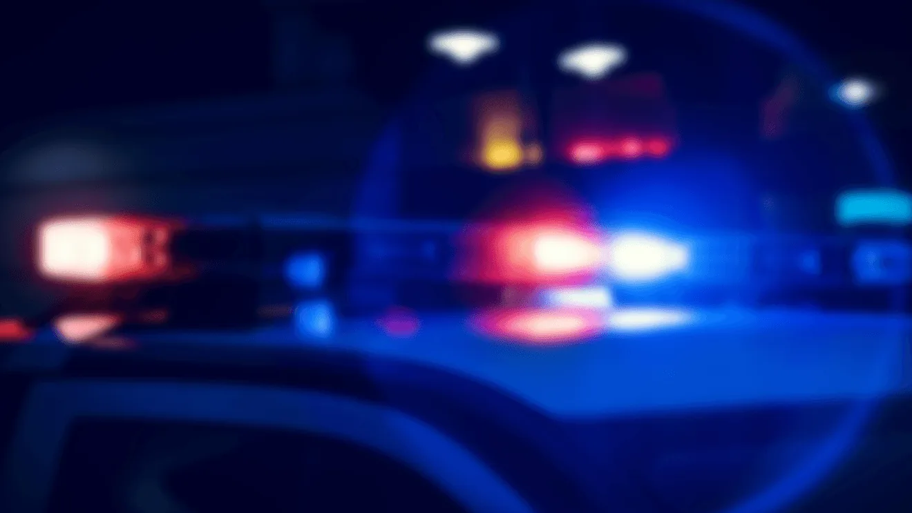 A sheriff's cruiser after a fatal crash investigation at a rural West Virginia intersection