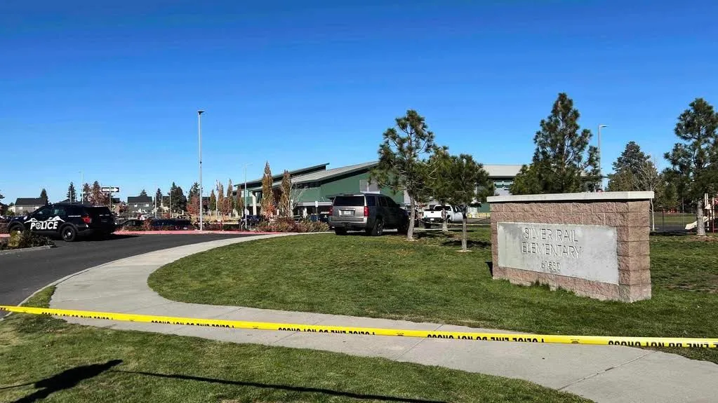 Police tape and emergency vehicles outside Silver Rail Elementary after a shooting in Bend, Oregon
