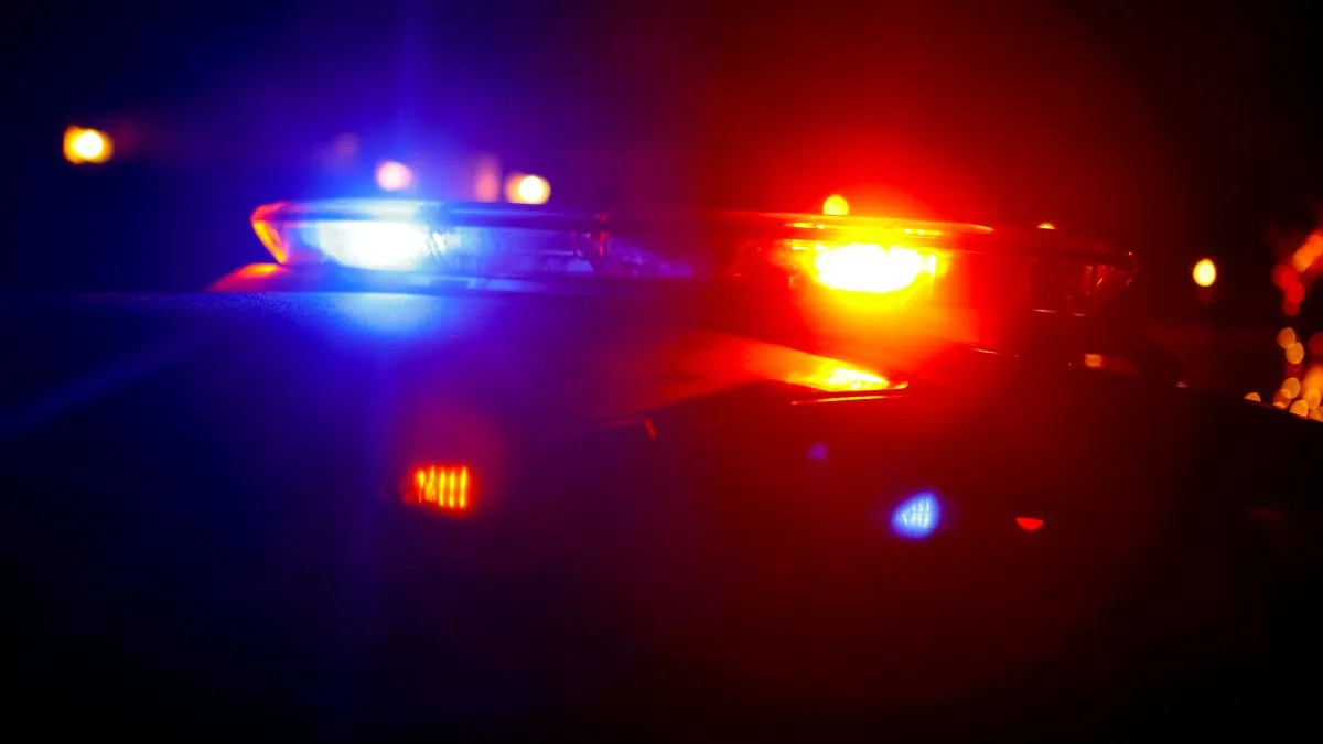 Police investigate a three-vehicle crash scene on a Connecticut roadway at night