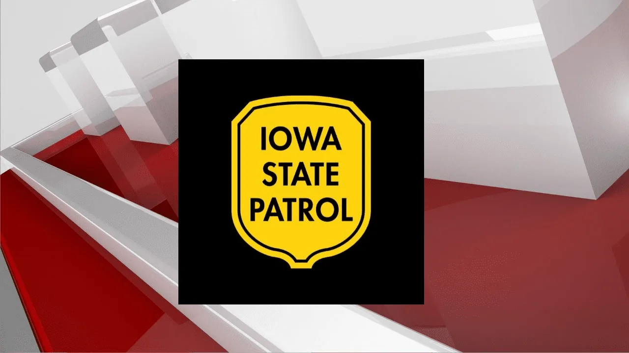 Emergency crews respond after a car hit a semi-trailer at a highway intersection in Osage, Iowa