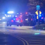 Police cars gathered near a park after a Belleville officer was struck during a traffic stop