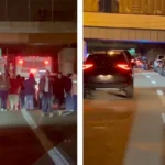 Police investigate a crash scene on Interstate 71 with traffic backed up for miles at night
