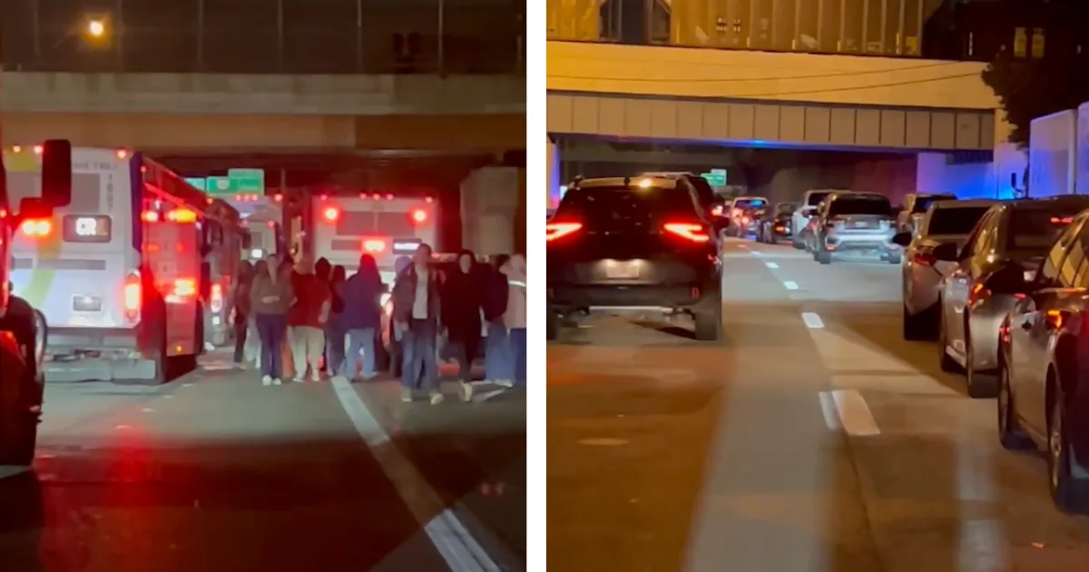 Police investigate a crash scene on Interstate 71 with traffic backed up for miles at night