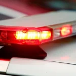 Police lights near a crashed SUV on a rural Pennsylvania road