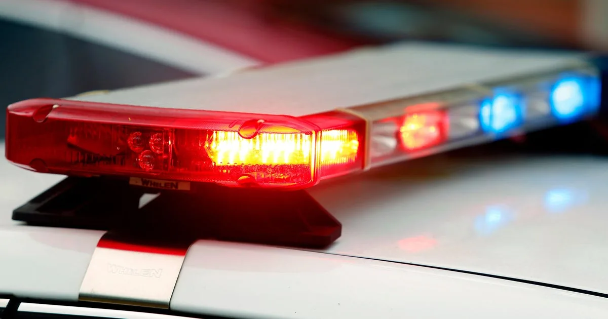 Police lights near a crashed SUV on a rural Pennsylvania road