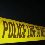 Police investigate a motorcycle crash on a roadway in Hopkinton, Rhode Island